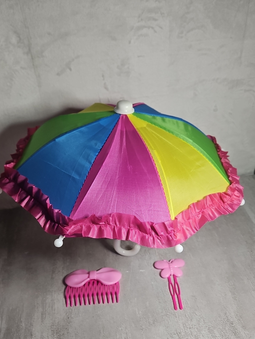 a miniature rainbow parasol With 2  small Pink Hair Clips
